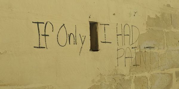 Wall in Malta displaying the words: If only I had paint